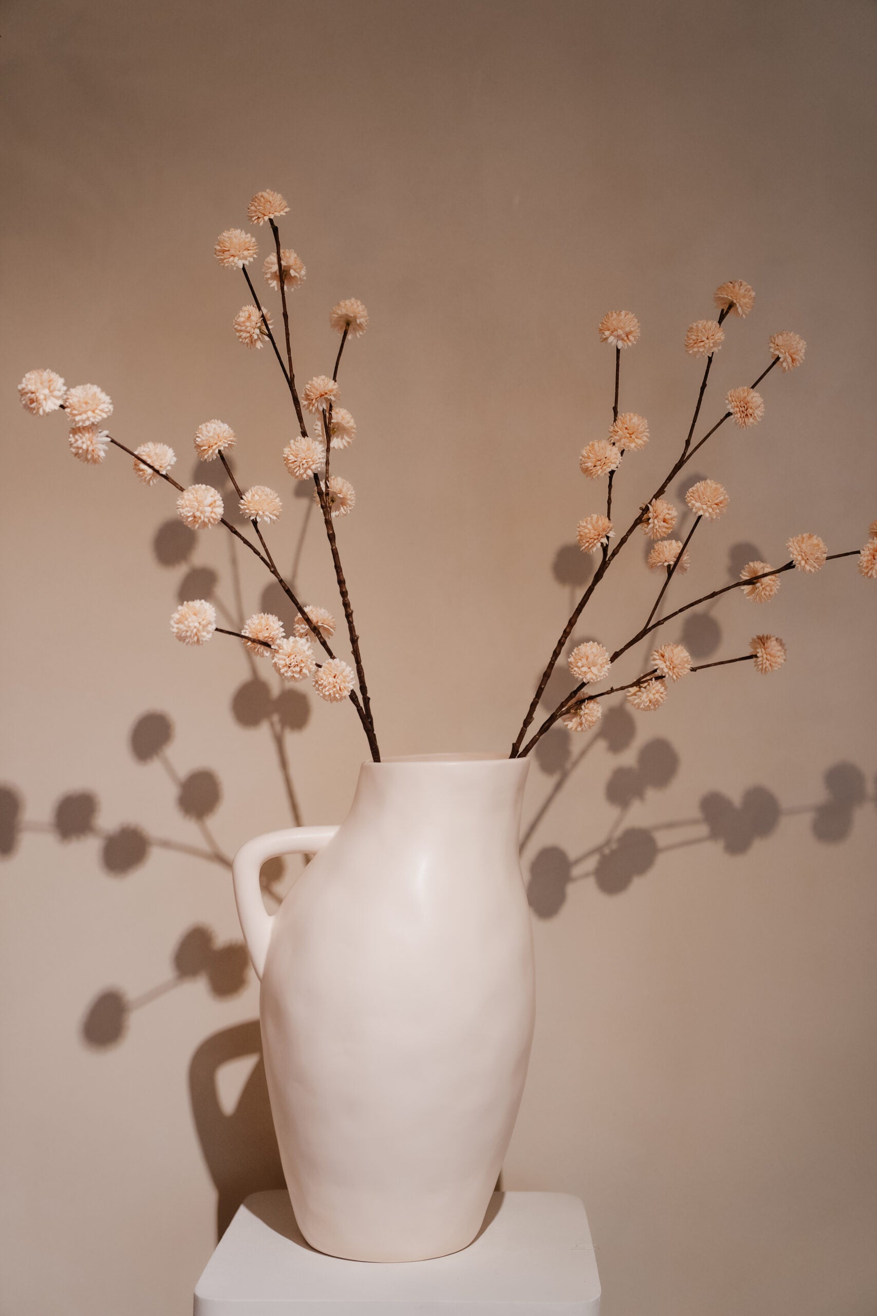 Artificial branch pompom spray M Cream
